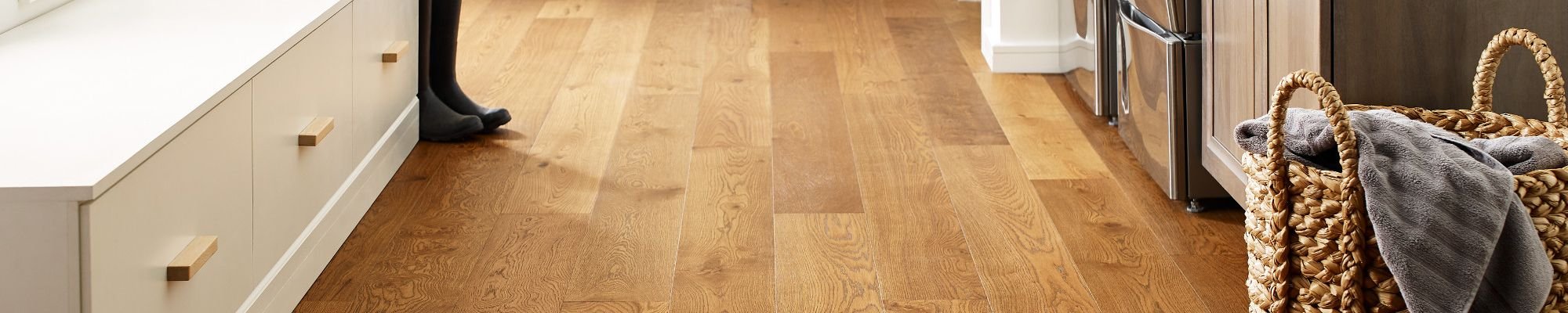 Laundry room with wood-look luxury vinyl flooring from Carpet Innovations in Denver, CO