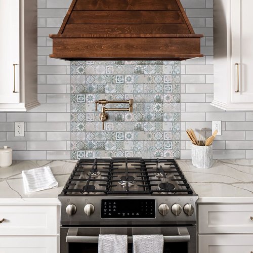 Kitchen with white marble countertops and a blue tiled mosaic backsplash from Carpet Innovations in Denver, CO