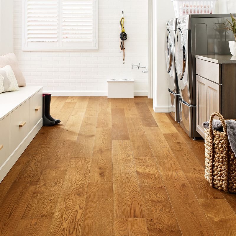 Laundry room with wood-look luxury vinyl flooring from Carpet Innovations in Denver, CO