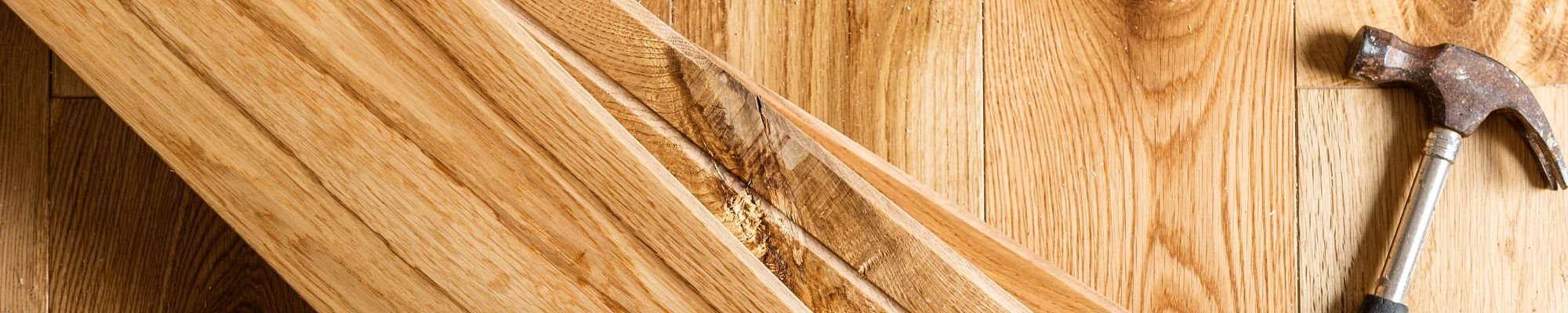 Hammer on hardwood planks - Flooring installation and consultation services from Carpet Innovations in Denver, CO